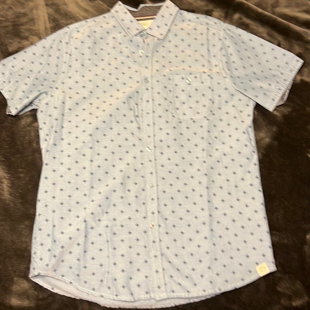 Free Planet button down shirt. Light Blue with Blue Star design.